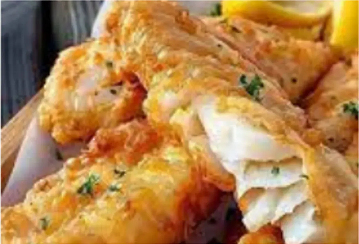 Golden, Battered and Fried Fish Fillets, Some Sliced to Reveal Flaky White Fish — Pt Cartwright Seafoods in Warana, QLD