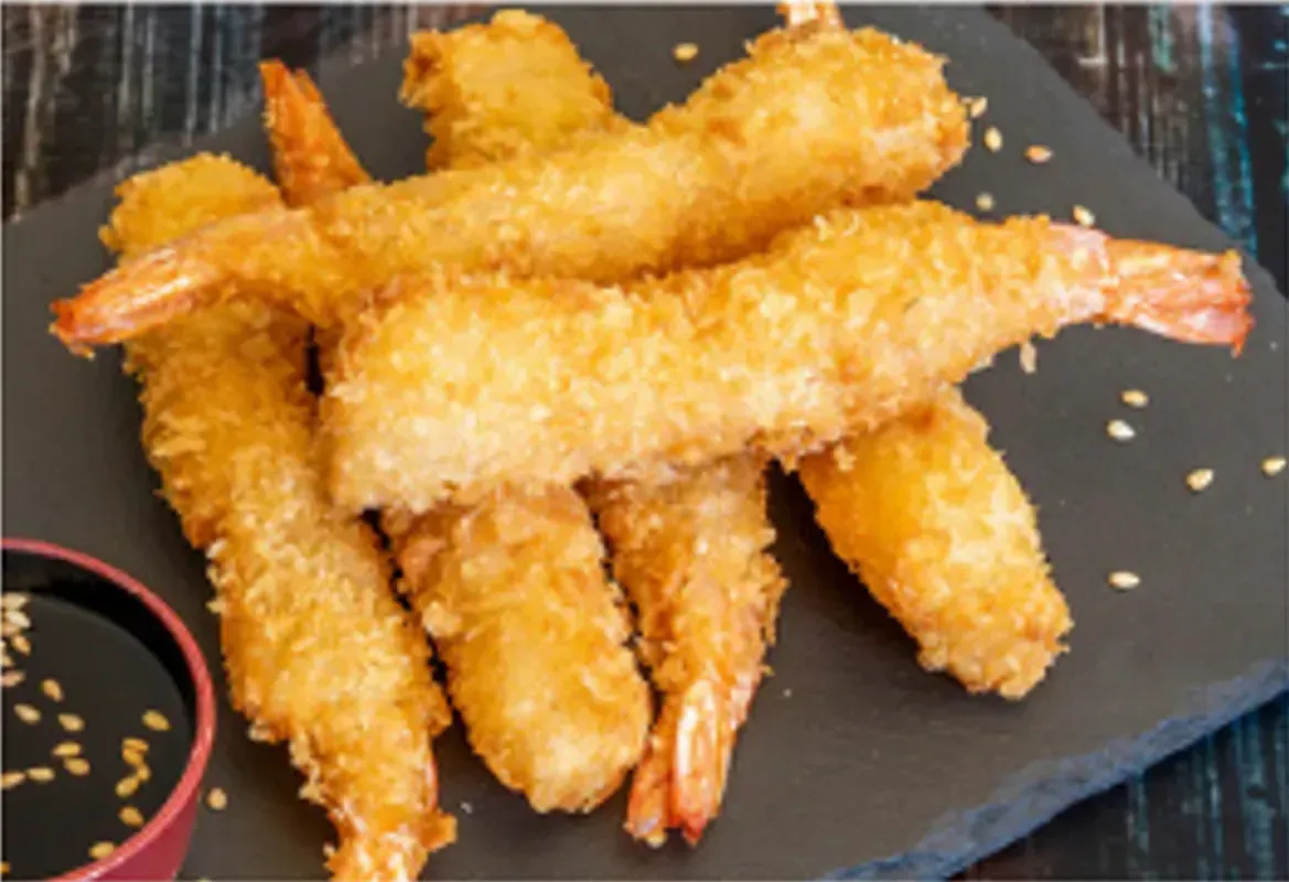 Golden Fried Shrimp on a Dark Slate Plate With a Small Dish of Dipping Sauce — Pt Cartwright Seafoods in Warana, QLD