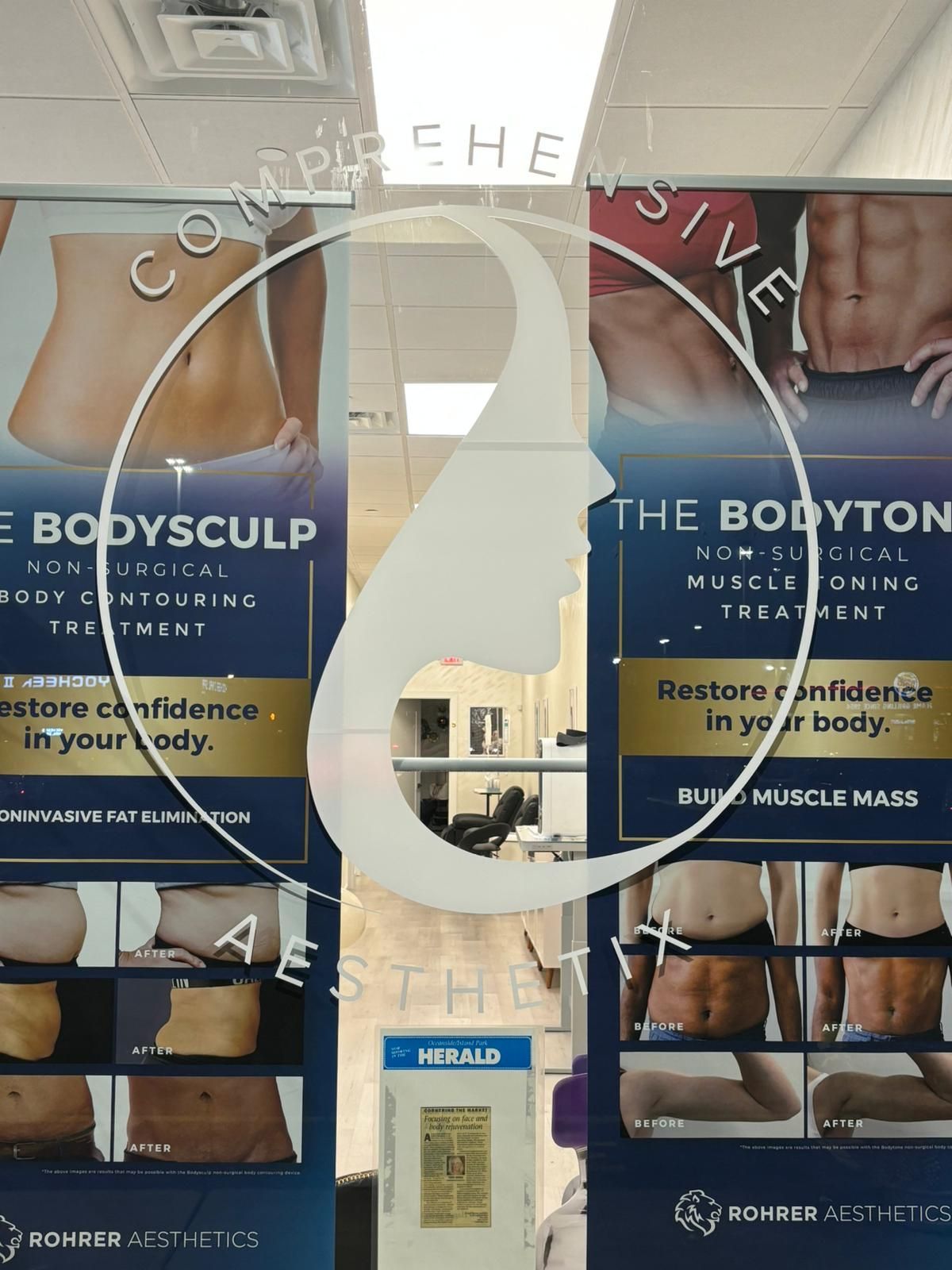 Clinic window with body sculpting posters and a blue door in the center.