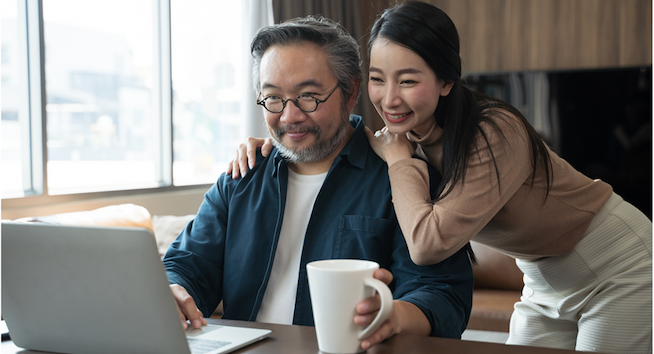 Senior Couple Checking Financial Documents — Chiefland, FL — Smith Asset Management Company