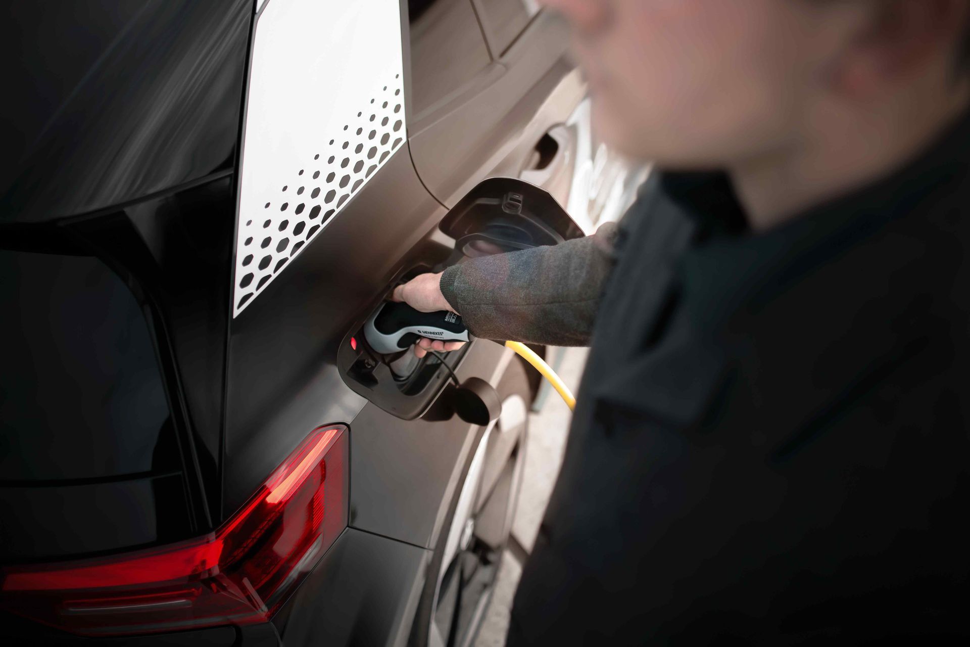 Man charging his Tesla car