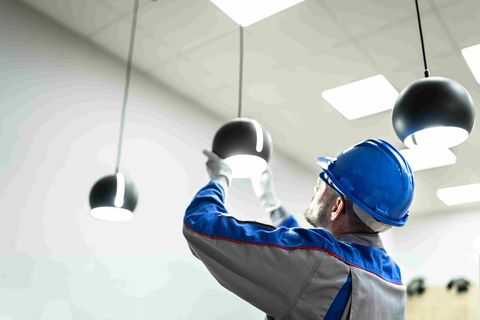 Man installing lights