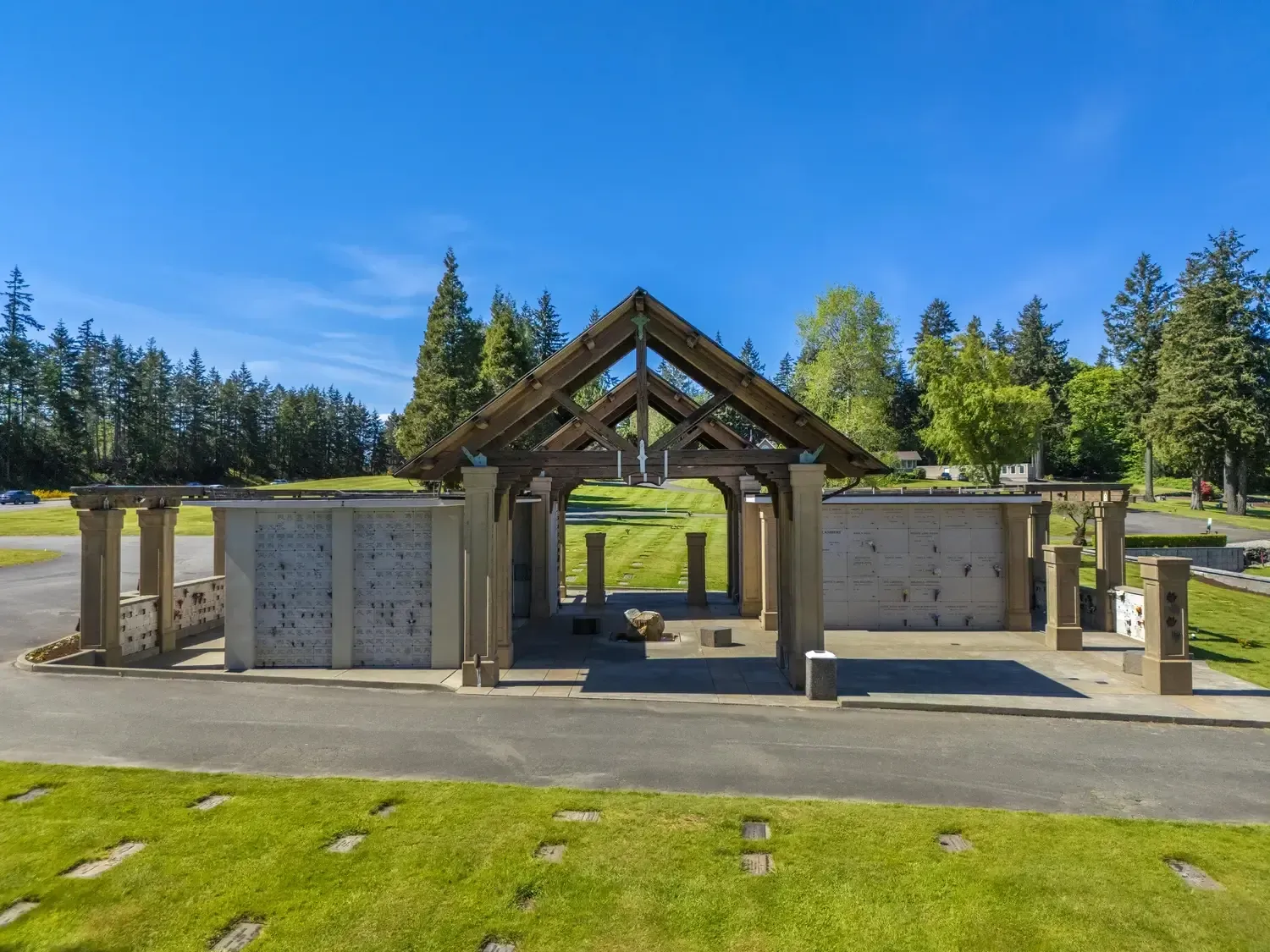 Memorial park pathways surrounded by trees and greenery