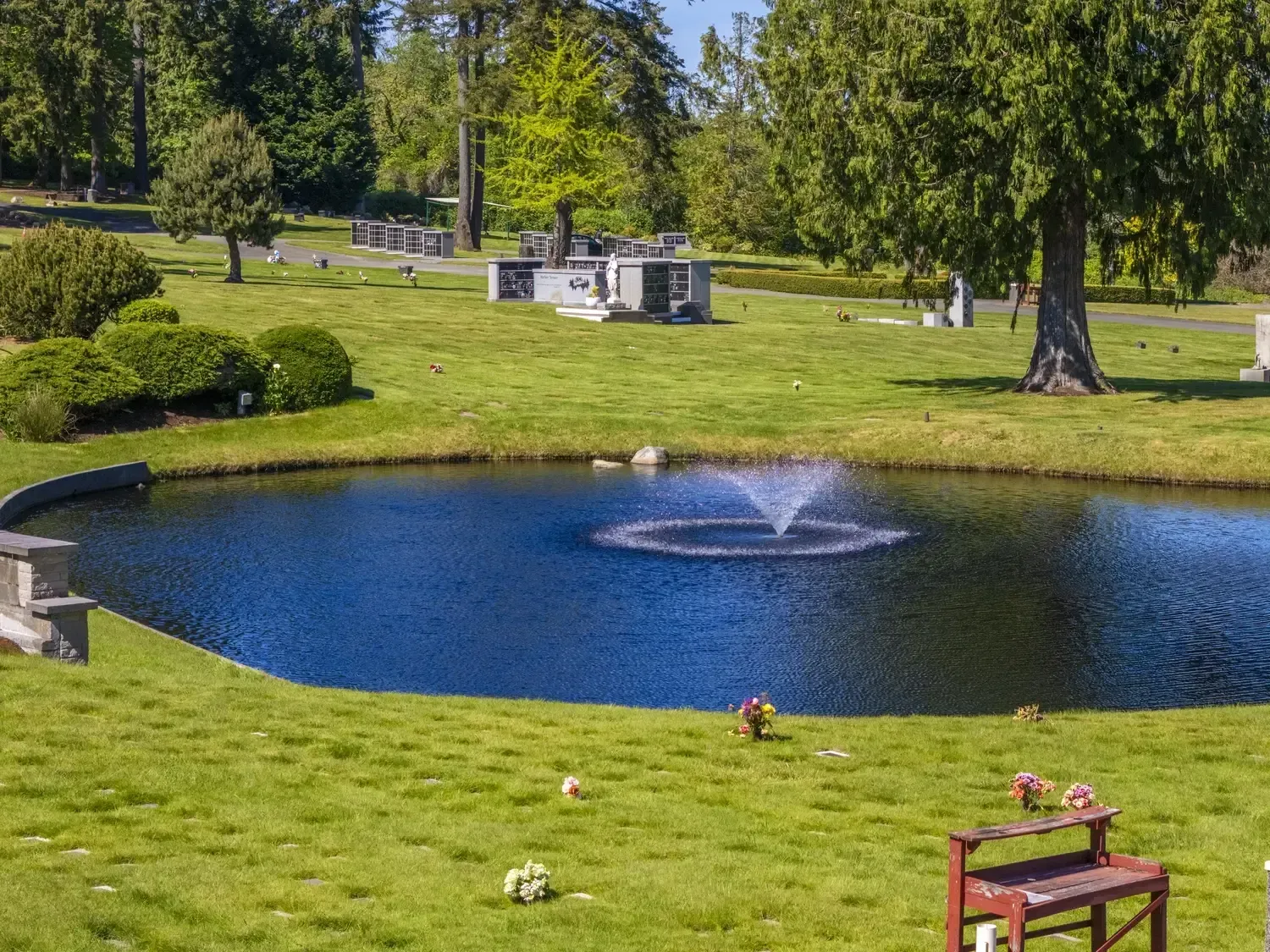 Wide aerial shot of beautifully maintained memorial grounds