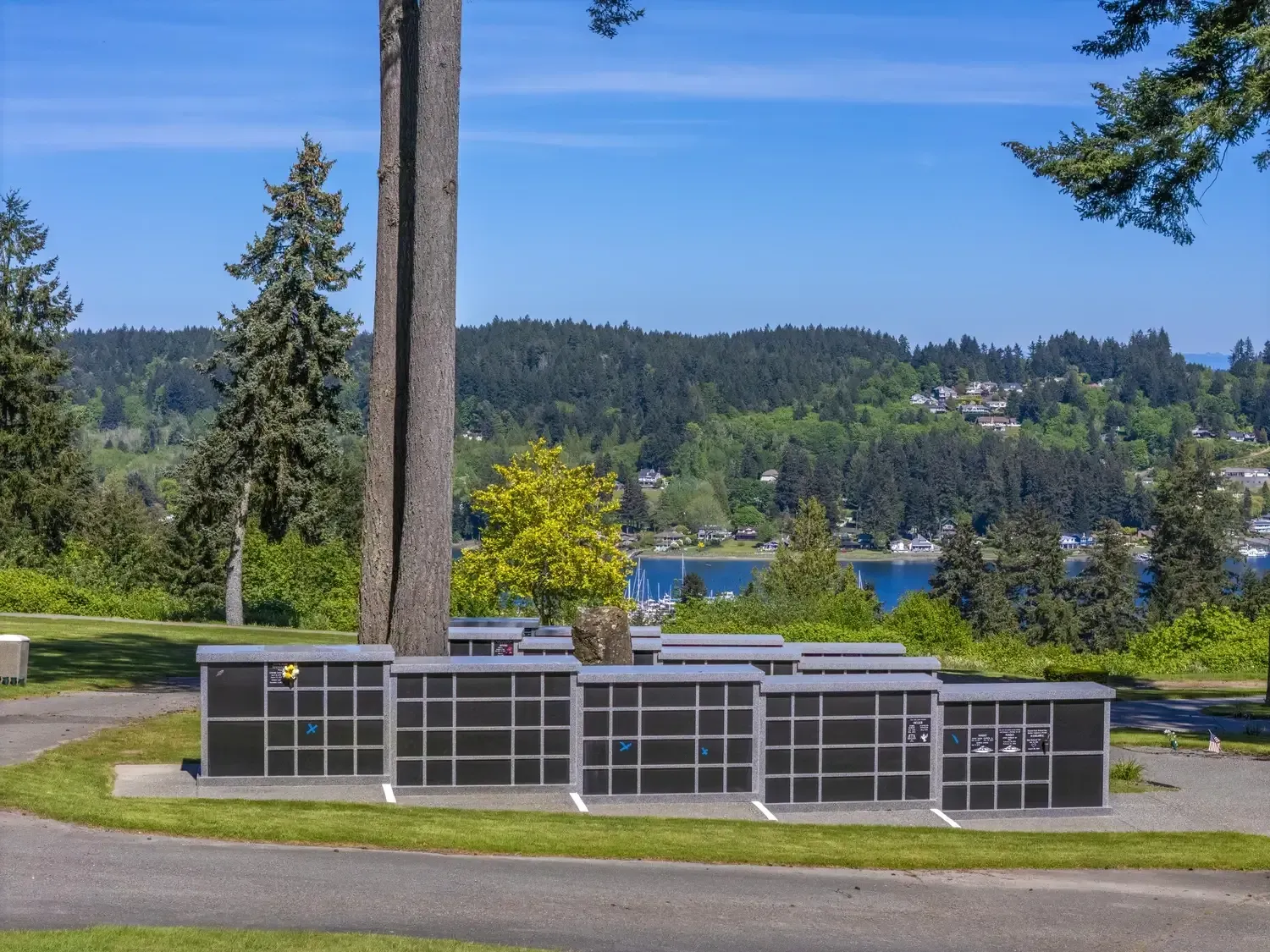 Outdoor remembrance area surrounded by landscaped greenery