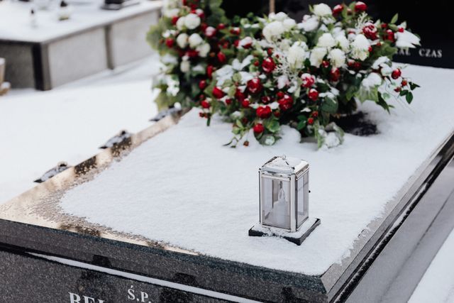 Memorial vigil candle on snow-covered gravesite for Port Orchard, WA funeral home and cremation services