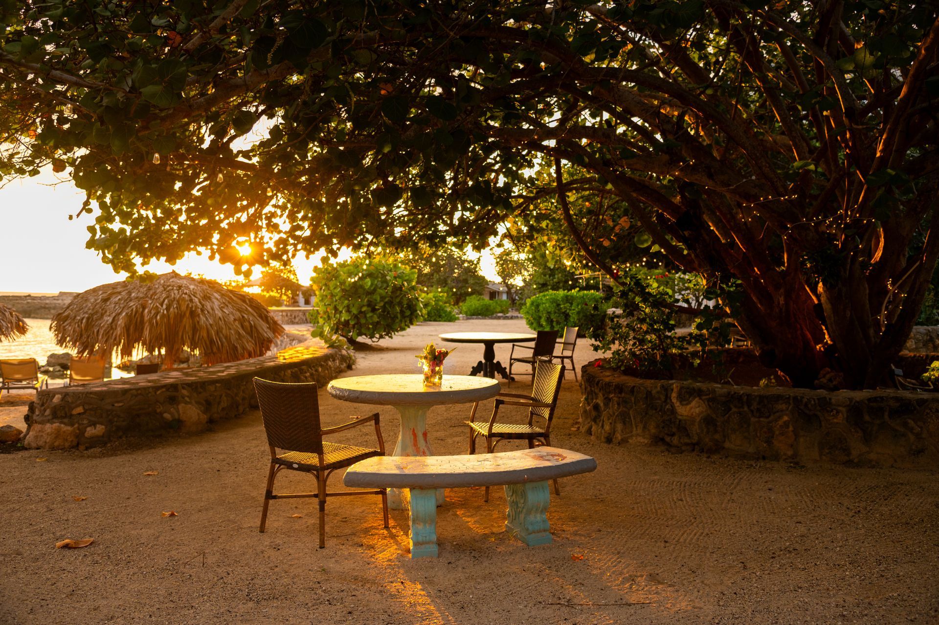 A group dining table set for sunset at Coral Cove