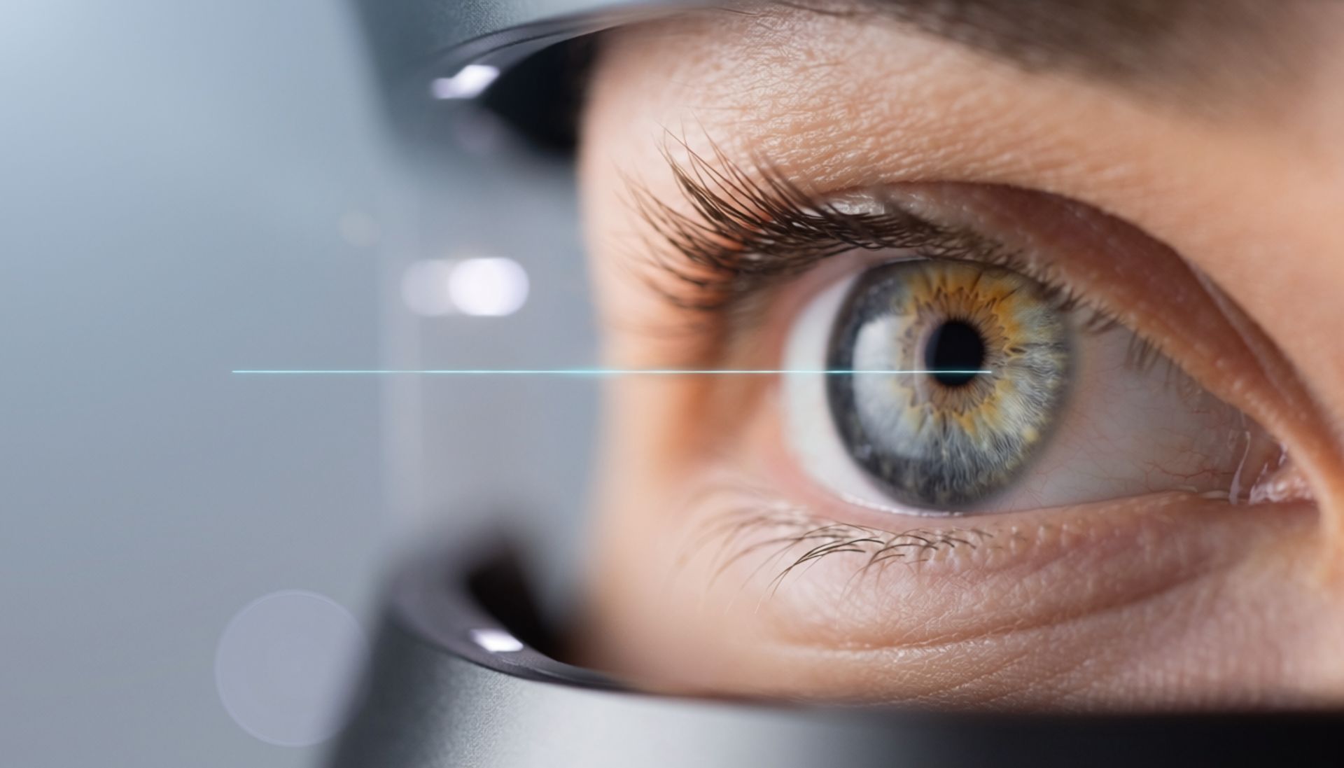 Close-up of an eye behind eyeglass lens, with a blue horizontal scan line overlay. Close-up of an eye behind eyeglass lens, with a blue horizontal scan line overlay.