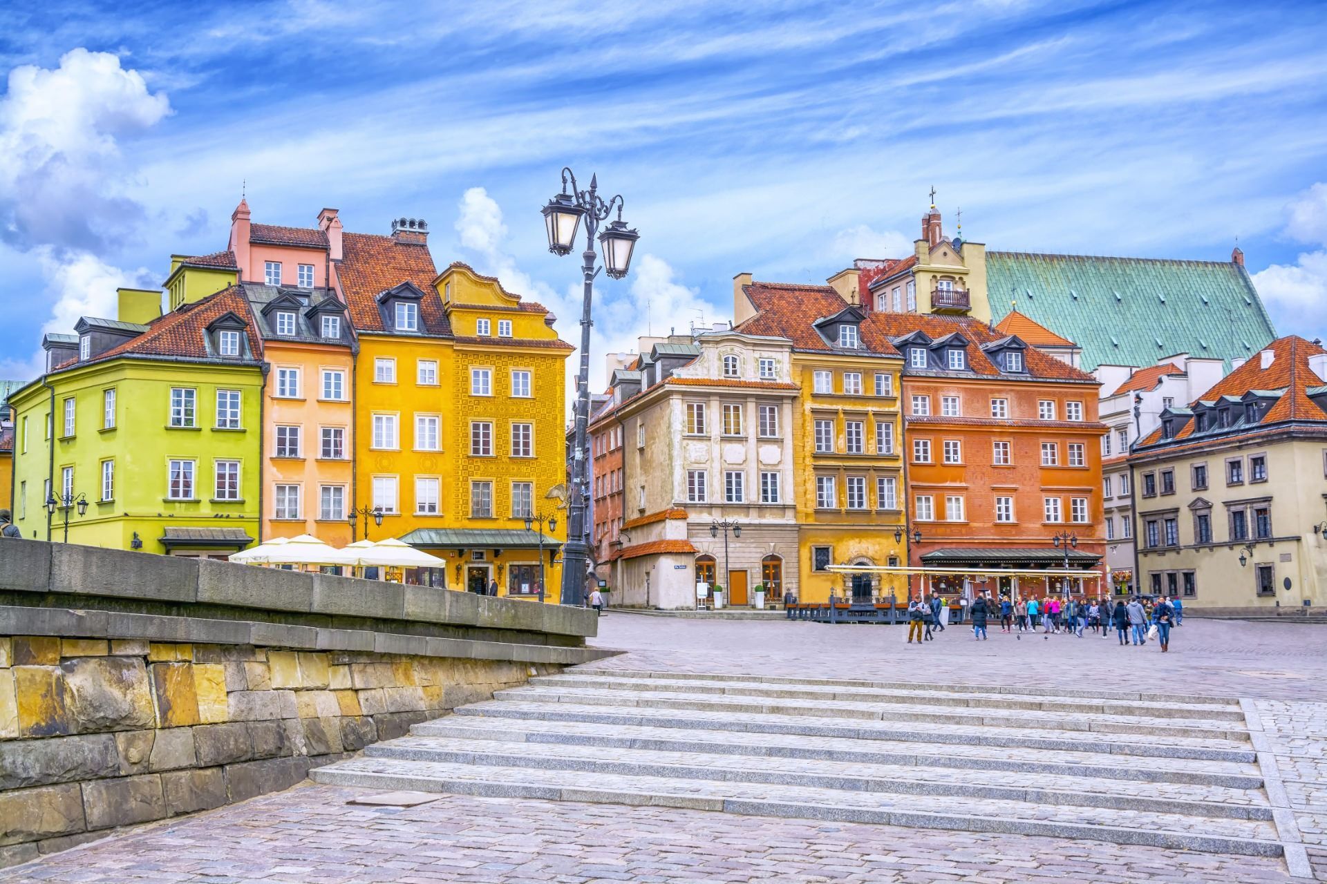 Colorful historic buildings and stone steps in a sunny European square