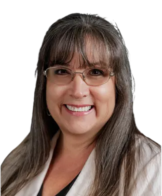 Chelsey White smiling with glasses and long dark hair against a white background