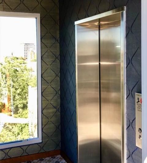 stainless steel elevator in modern commercial building