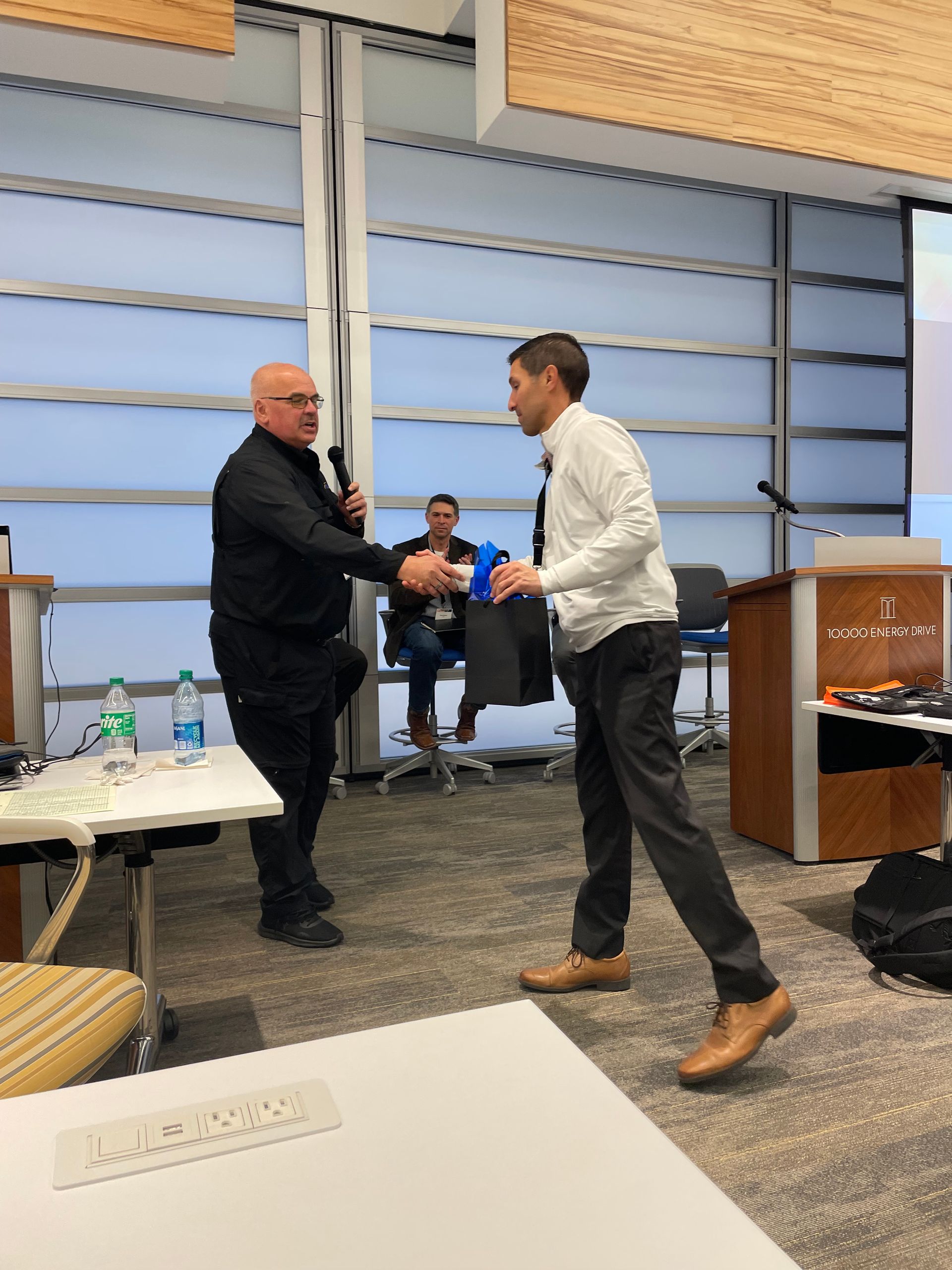 Jim oberkircker presenting committee gift