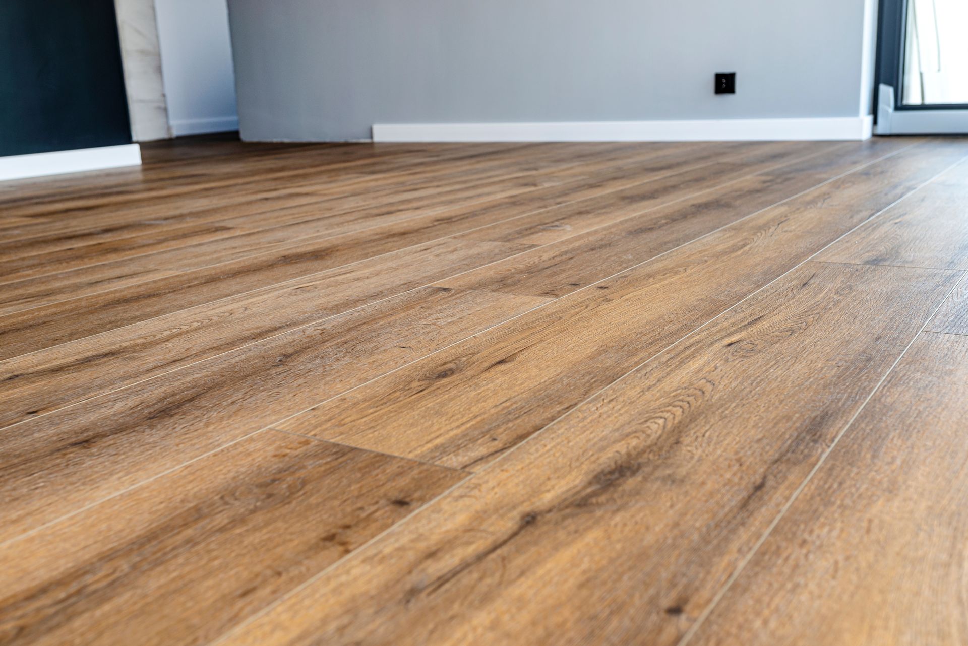 Professional flooring contractor completing flooring installation in Riverwoods Illinois, Lake Cook Hardwood and Flooring team working on residential property in Riverwoods IL