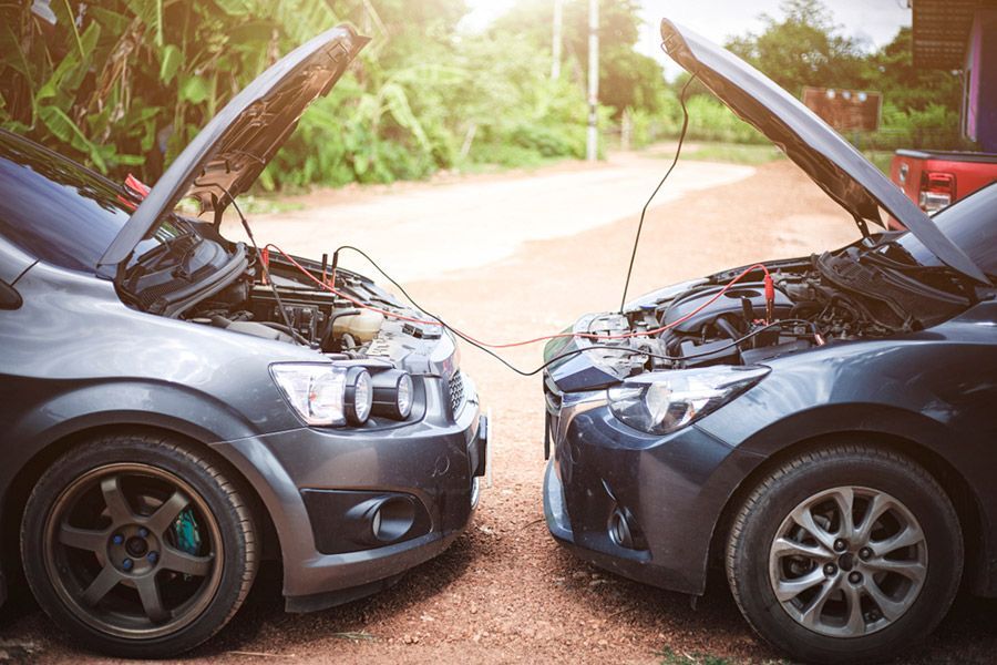 Two Cars Are Connected with Their Hoods Open — GT Auto Center in Tweed Heads South, NSW