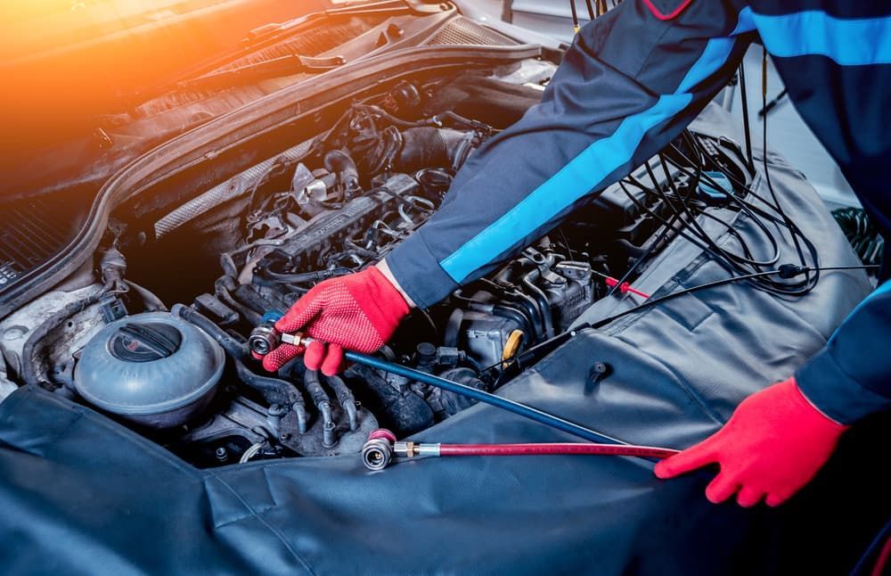 A Mechanic Is Working on The Engine of A Car — GT Auto Center in Tweed Heads South, NSW