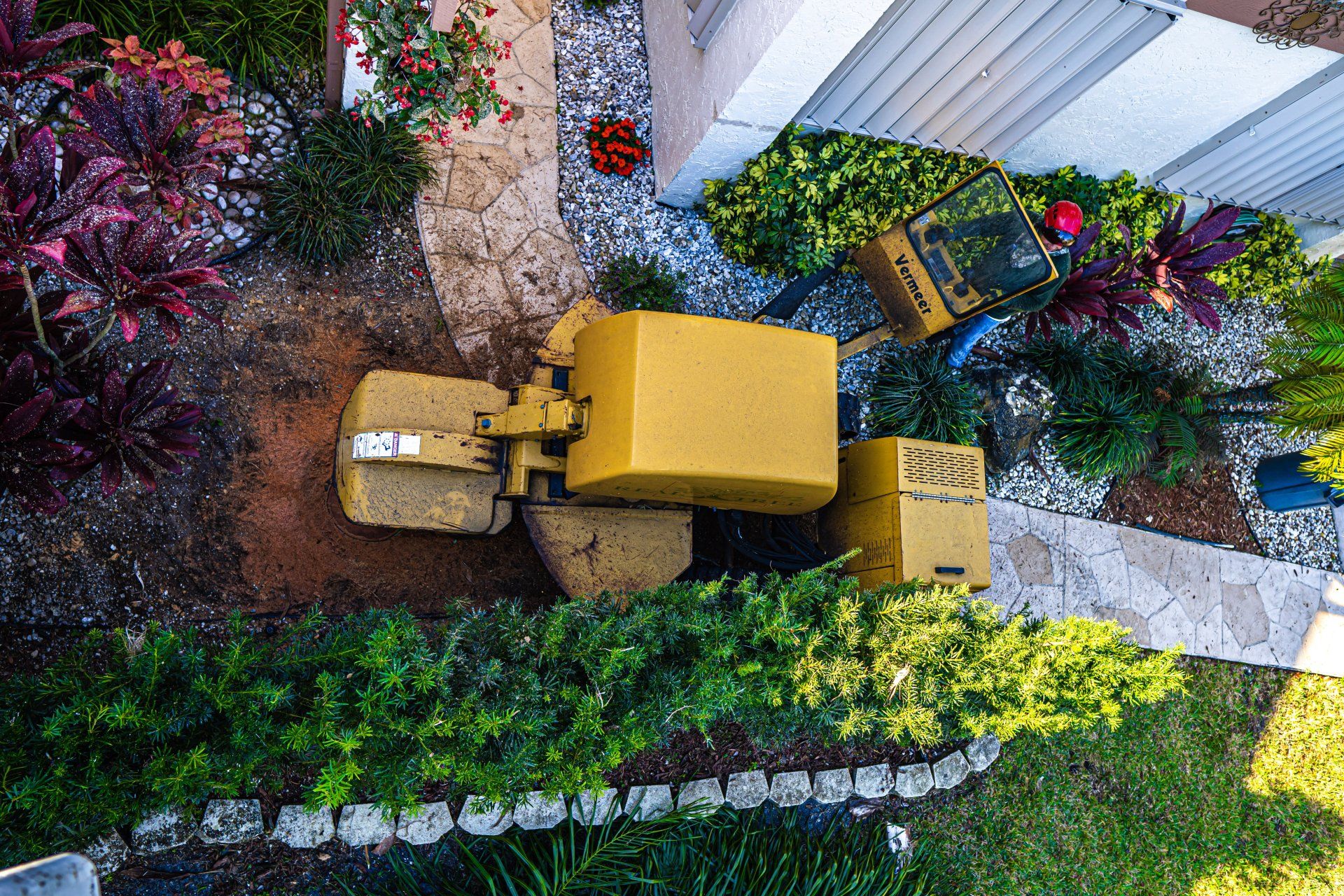 Real Tree Trimming & Landscaping, Inc. tree care pro performing stump excavation