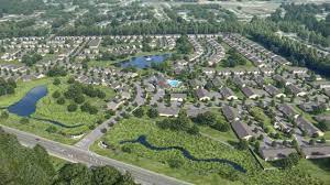 An aerial view of a residential area with lots of houses and trees.