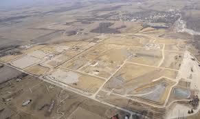 An aerial view of a residential area in the middle of a desert.