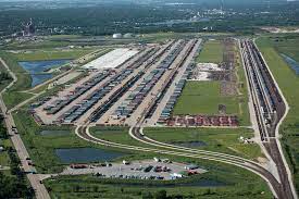 An aerial view of a train yard filled with lots of trains.
