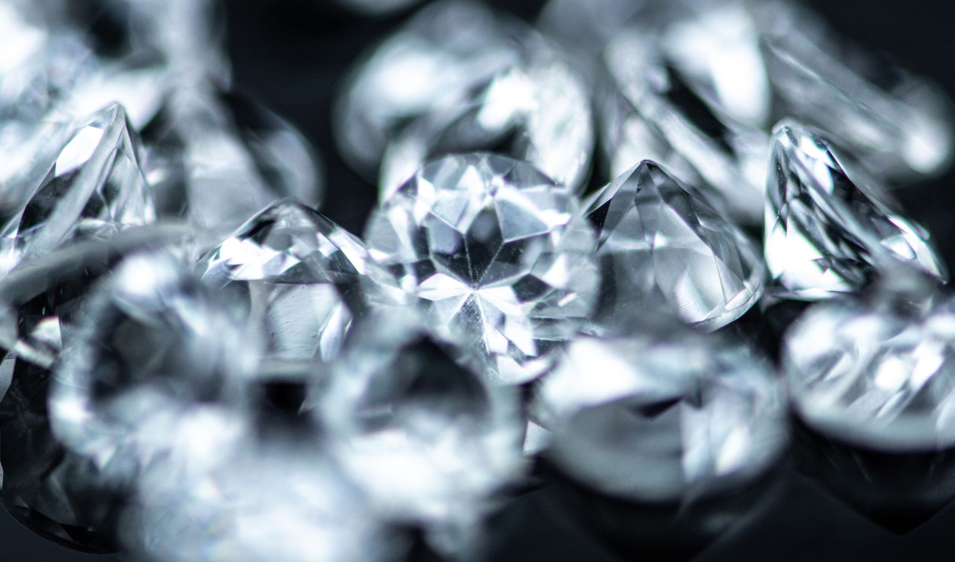 Close-up of small diamonds on black, highlighting cash for diamonds offers elegantly. Close-up of small diamonds on black, highlighting cash for diamonds offers elegantly.