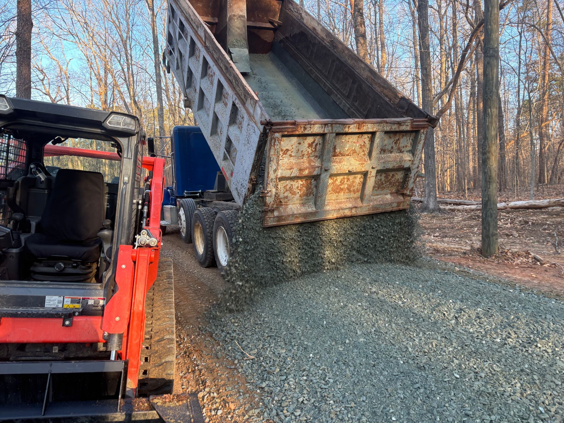 The truck is loading the soil to fill the ground