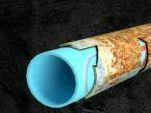 Blue plastic pipe with rusty metal clamp.