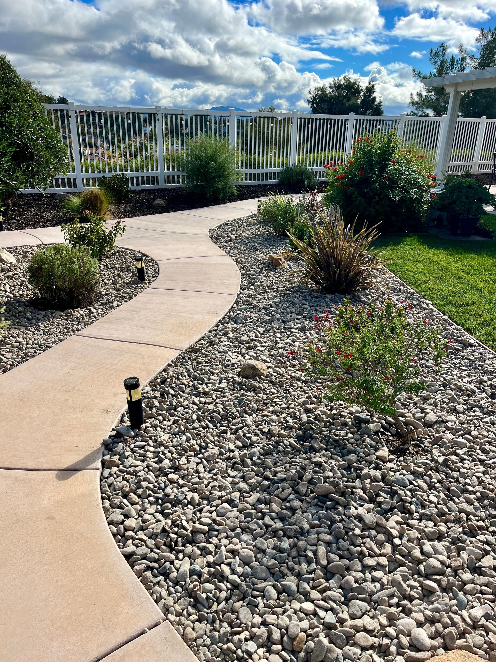 Lawn Maintenance & River Rock Installation in Murrieta, CA