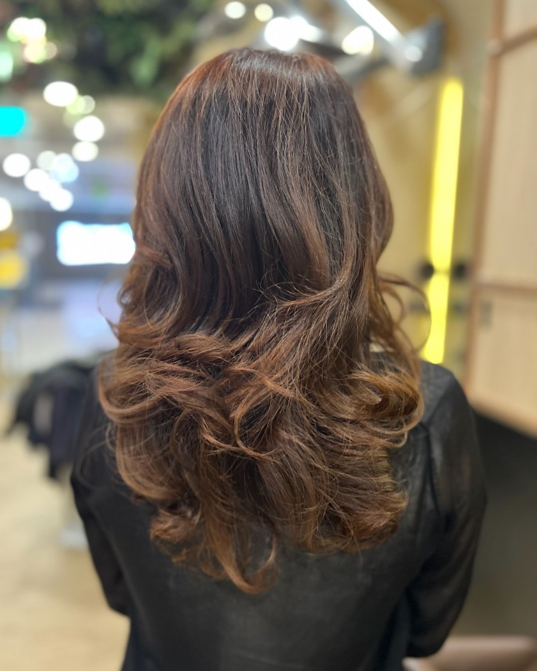 A photo featuring an espresso brown hair color