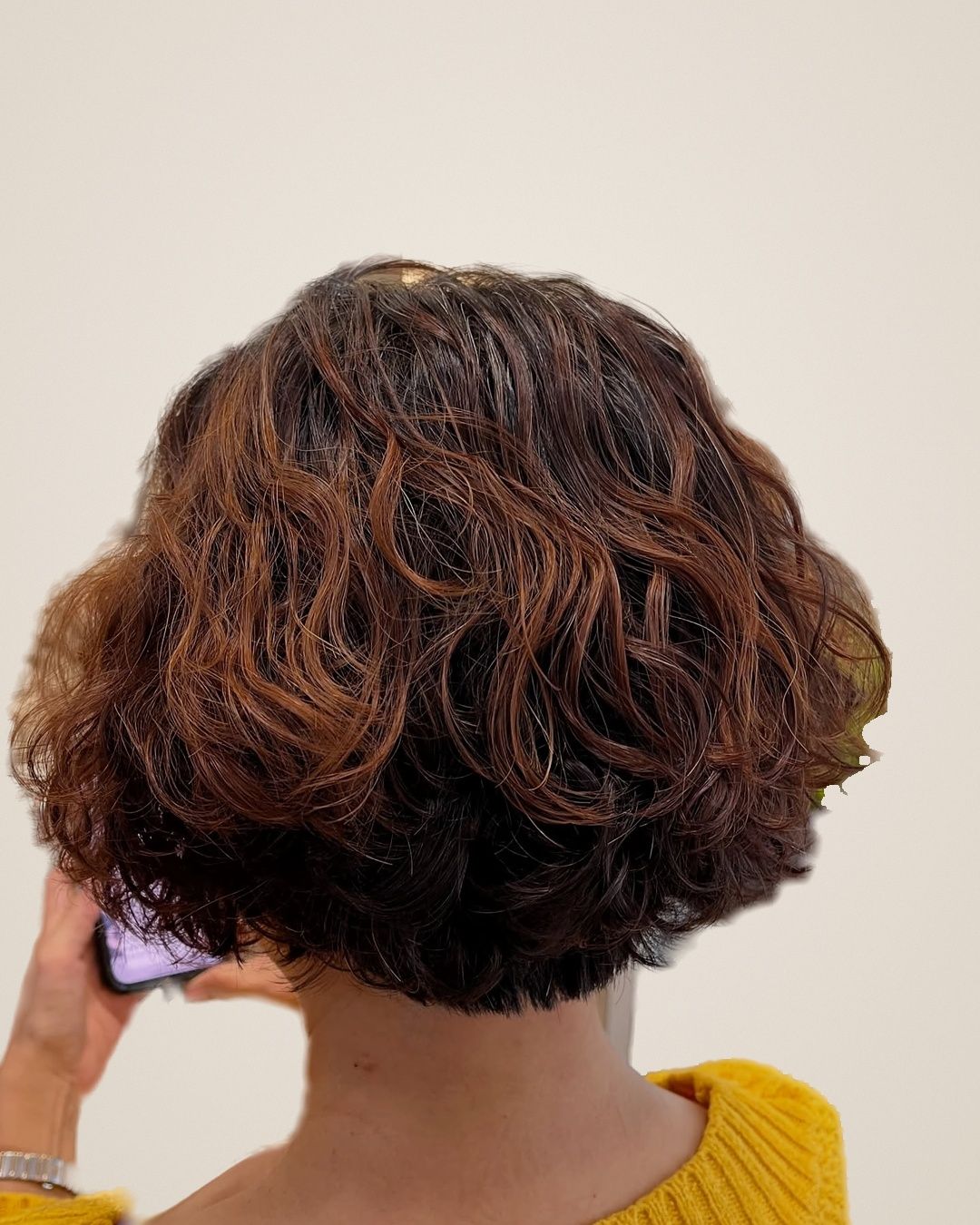 Back view of a short brown bob with defined S-curl waves and copper tones, created by Calie at Kimage Salon Singapore