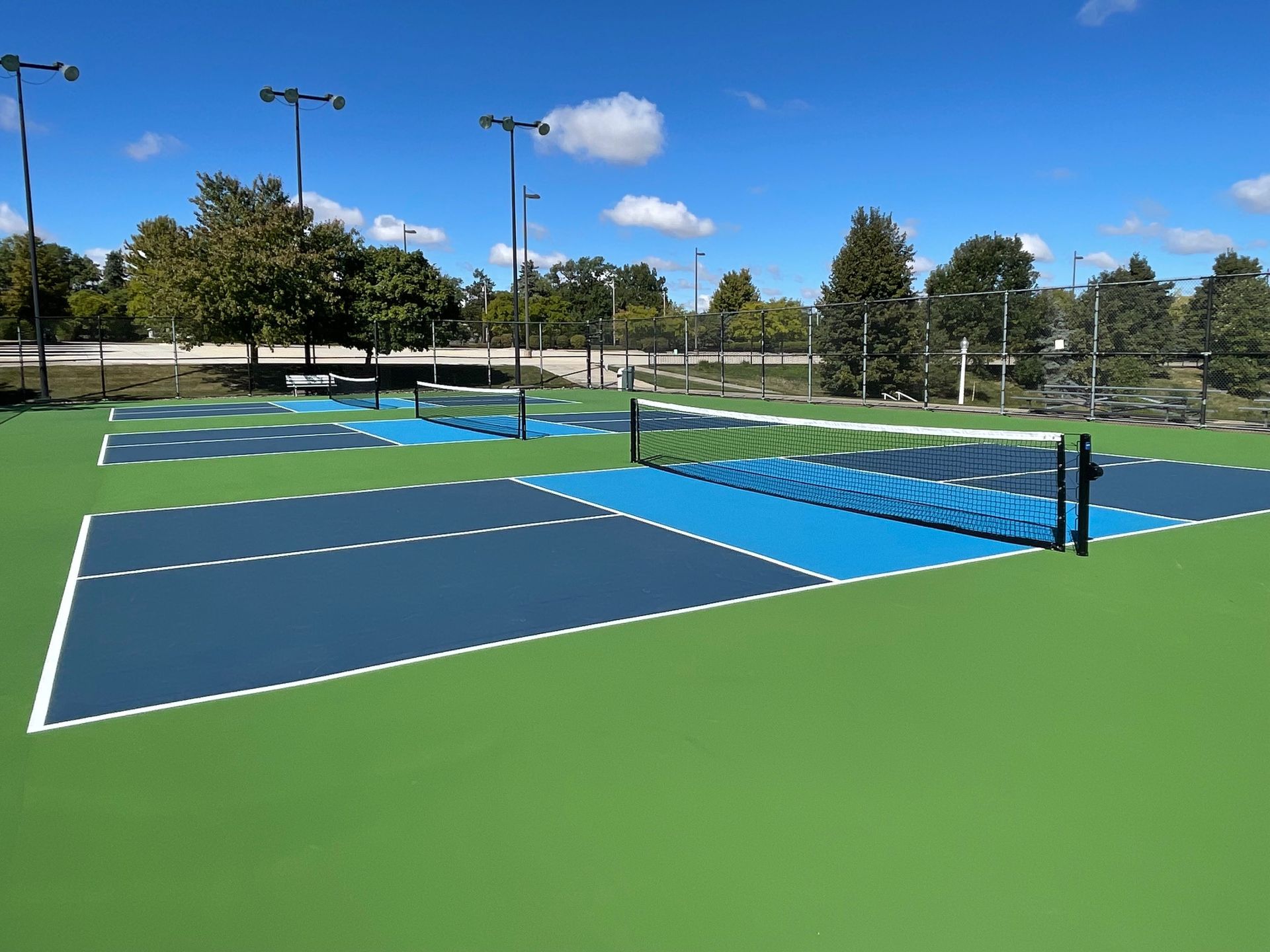 two men are playing tennis on a tennis court .