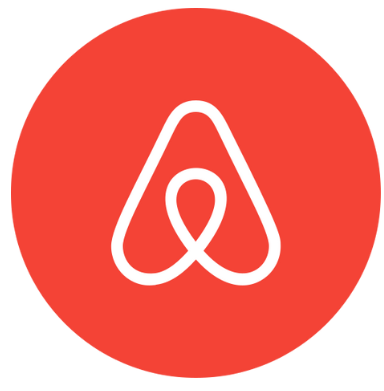 Logotipo de Airbnb: una “A” estilizada en blanco sobre un fondo circular rojo.