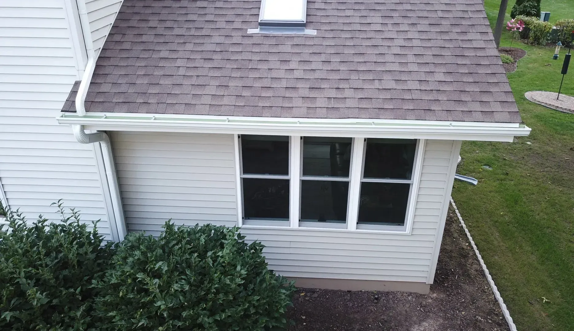 An aerial view of a house with a window and a roof.