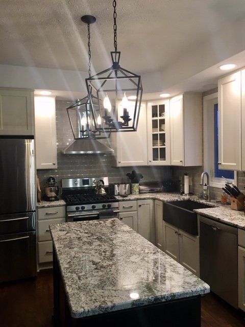 A kitchen with granite counter tops and stainless steel appliances