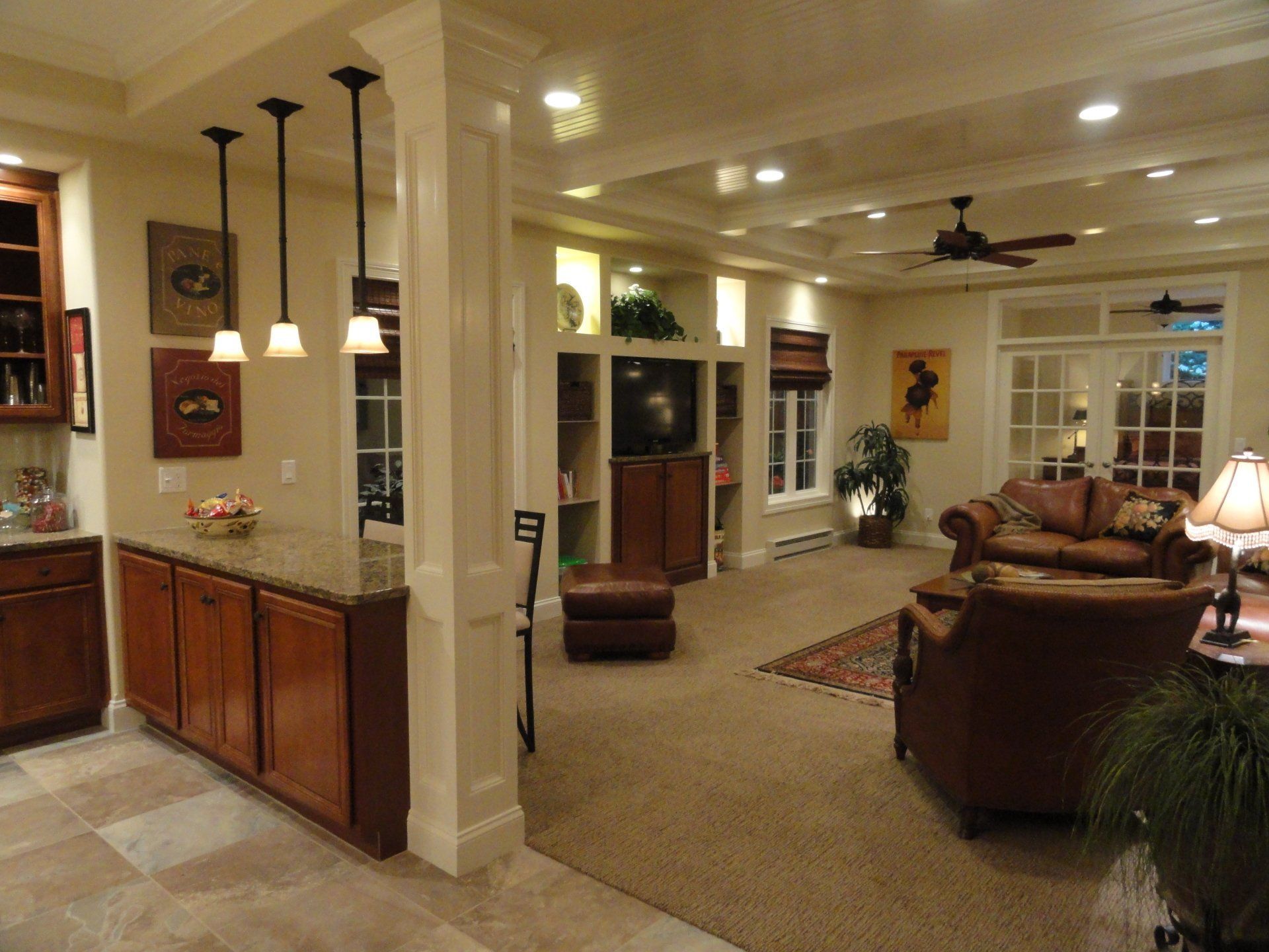 A living room with furniture and a ceiling fan