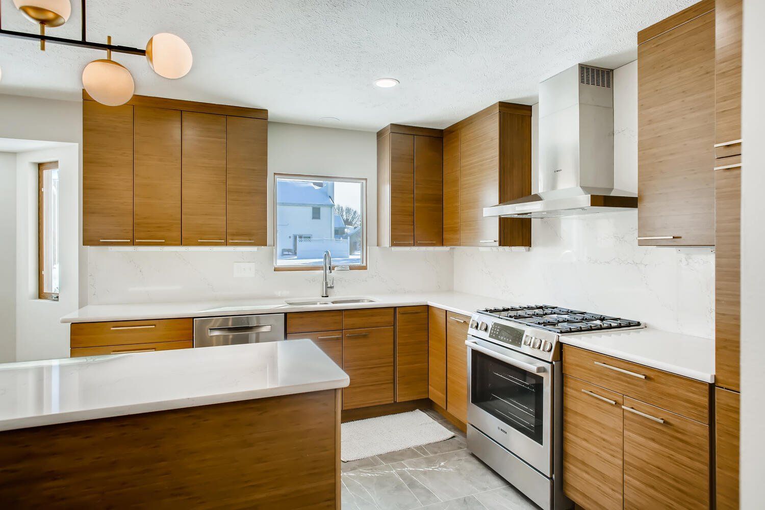 A kitchen with wooden cabinets and stainless steel appliances.