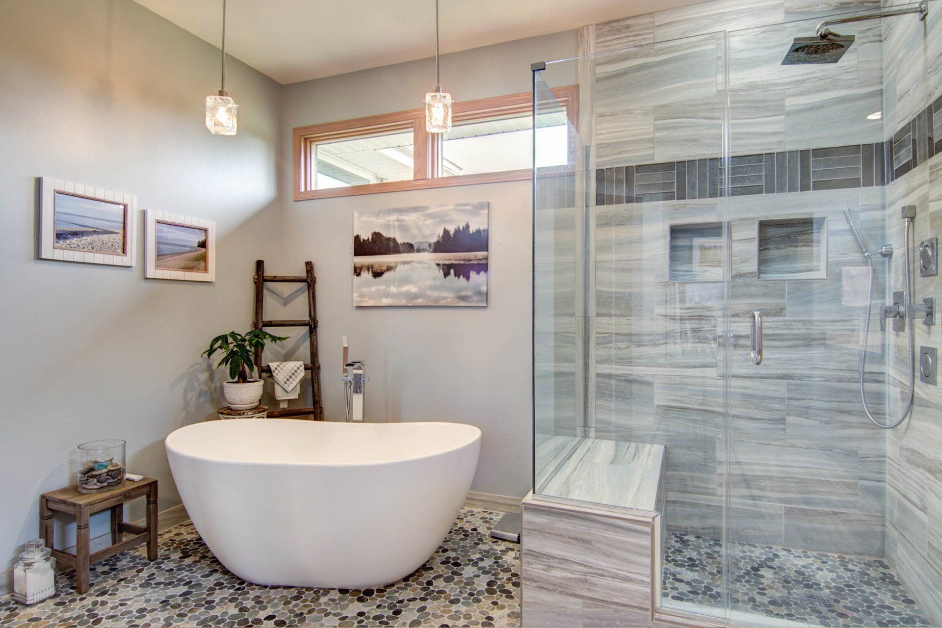 A bathroom with a bathtub and a walk in shower.