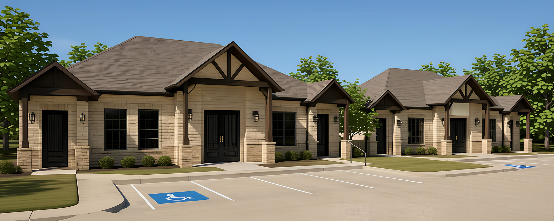 Single-story apartment buildings with stone facades and parking spaces, including accessible parking markings.