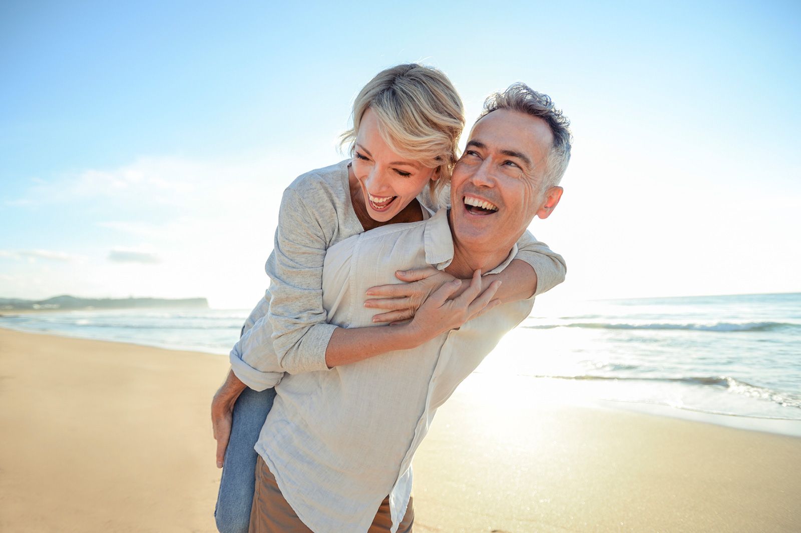 Couple Playing on the Beach — Townsville, QLD — Advanced Counselling Solutions