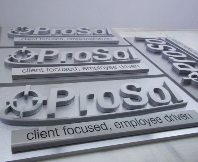 Three metallic Prosol logos with the tagline “client focused, employee driven” on a gray background