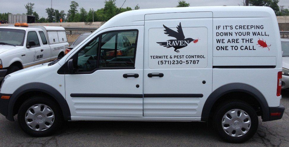 White delivery van with company logo and large black slogan text on the side.