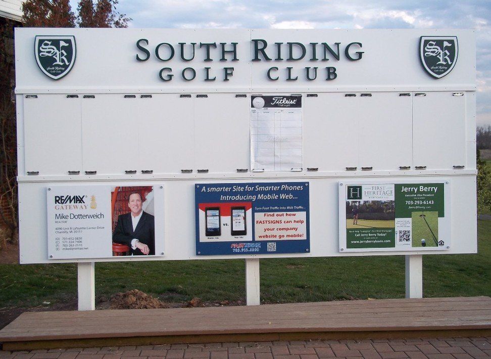 South Riding Golf Club signboard with a large blank schedule display and several notices