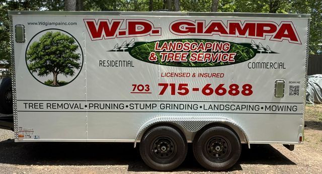 W.D. Giampa landscaping and tree service truck with green tree logo and phone number 703-715-6688