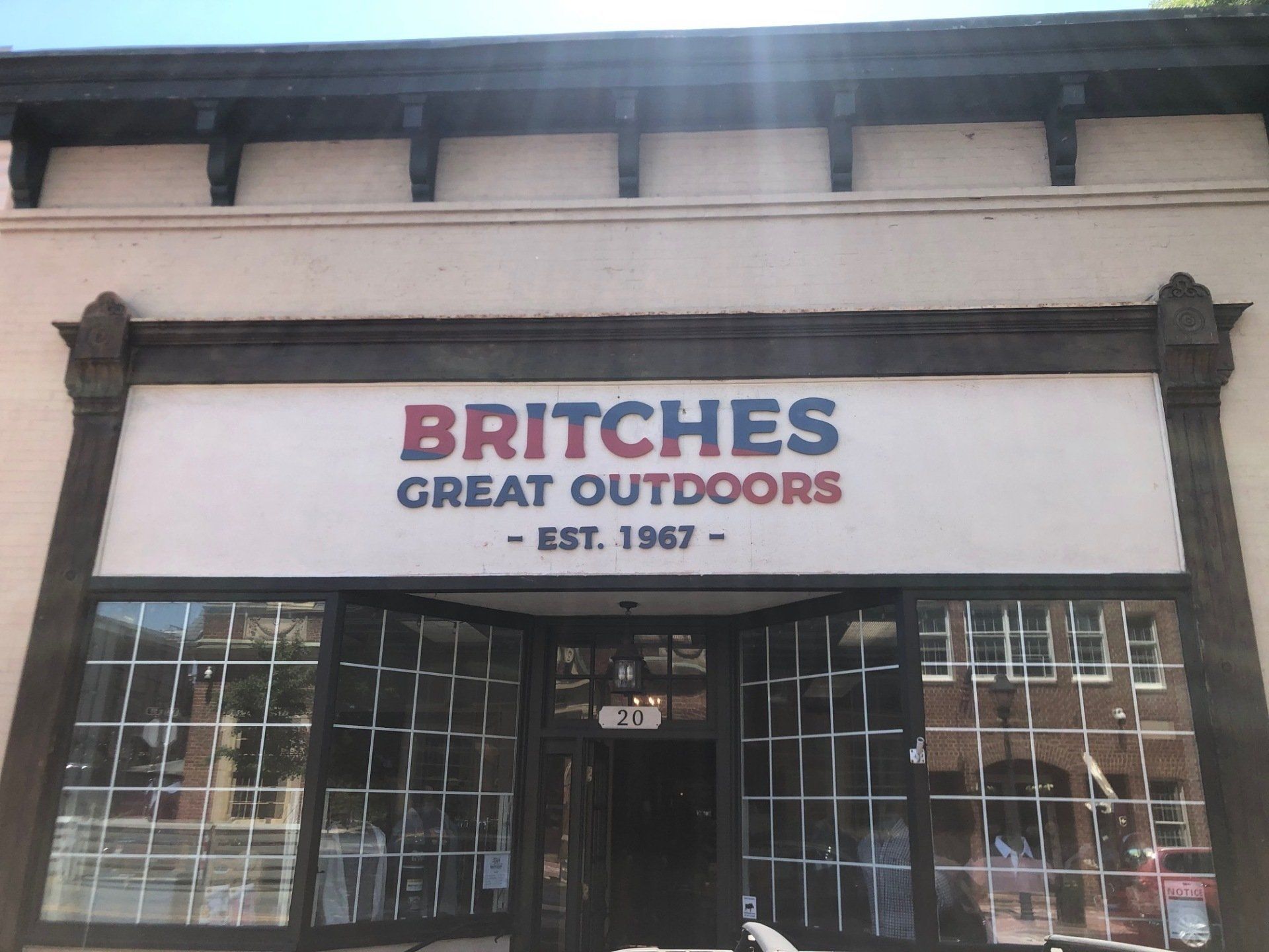 Storefront sign reading “BRITCHES Great Outdoors” on a building exterior.