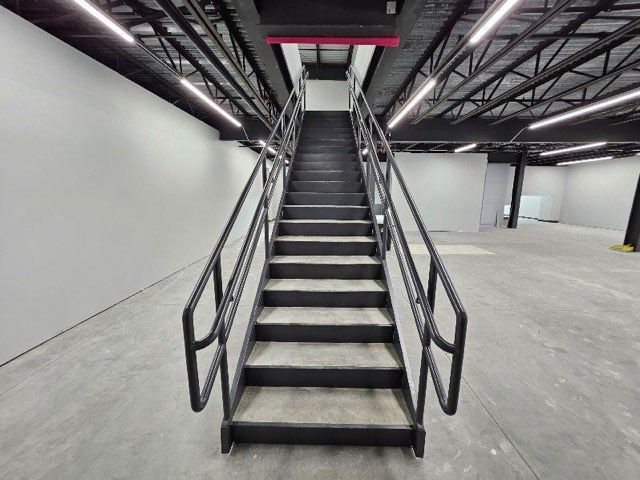 A set of stairs leading up to the second floor of a building.