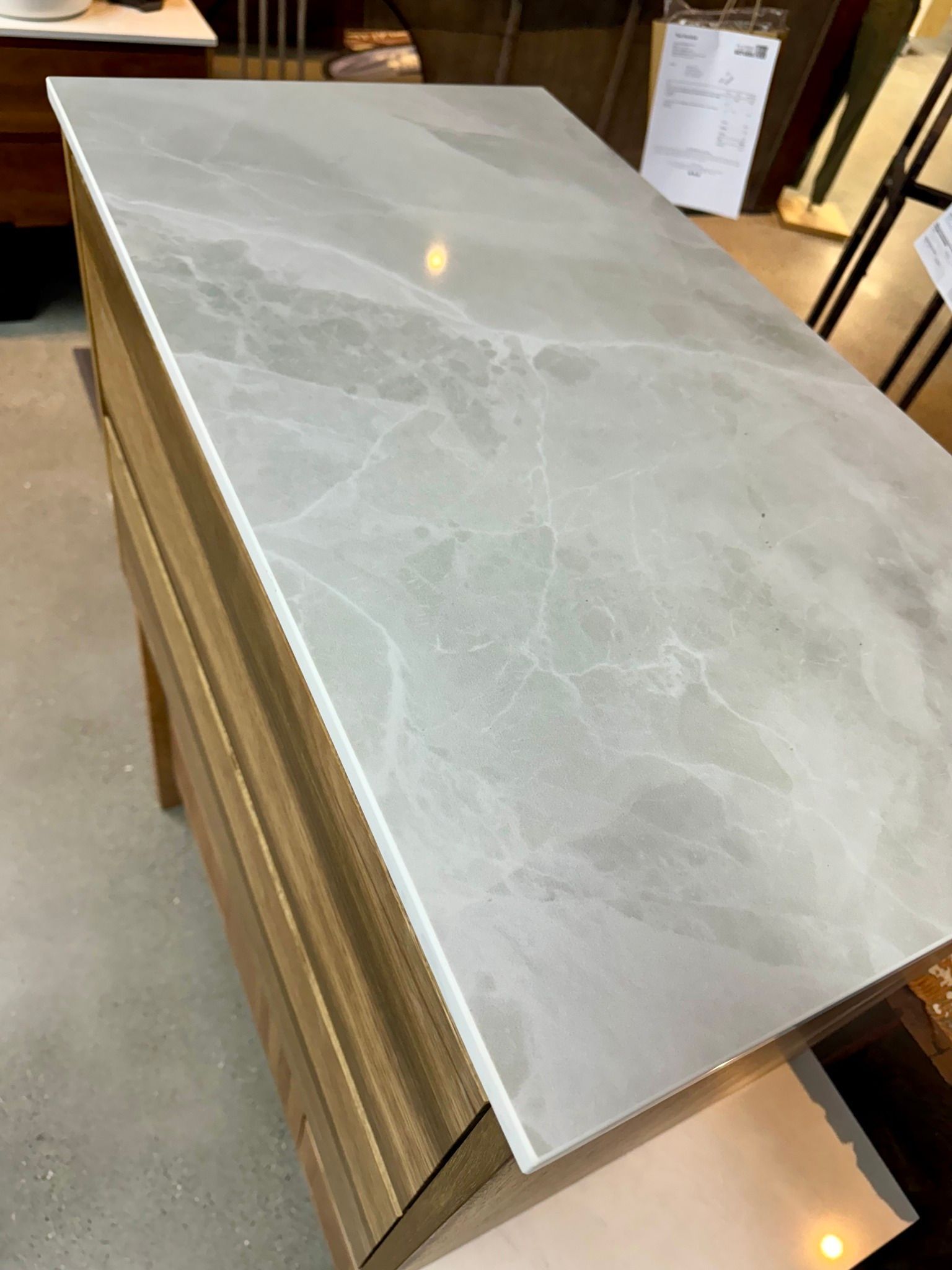 A Light Gray Marble-Patterned Countertop on A Wooden Cabinet — Lukas Joinery in Newcastle, NSW