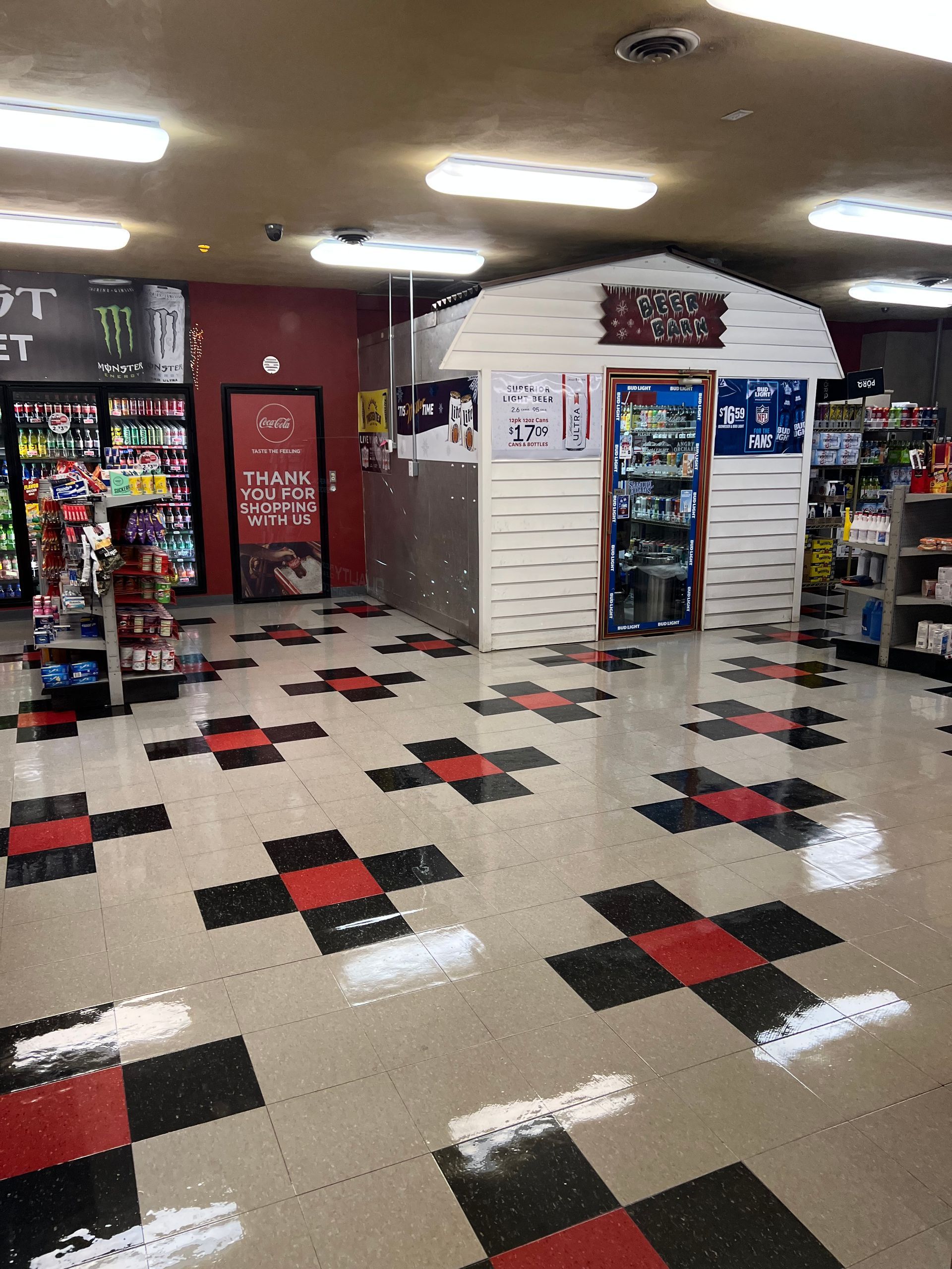The inside of a store with a checkered red and black floor.