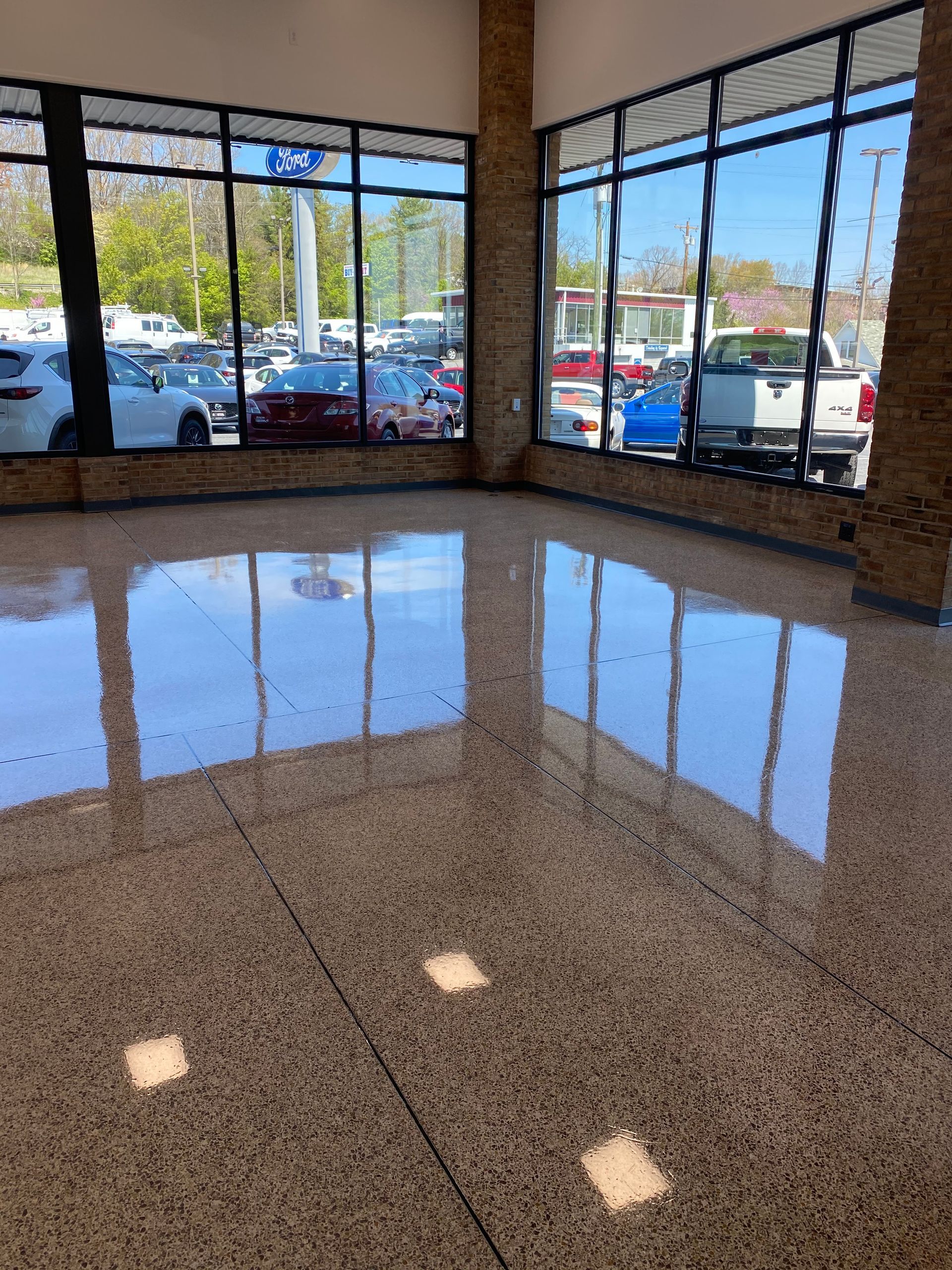 A room with a lot of windows and a shiny floor.