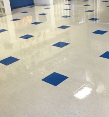 A white floor with blue squares on it