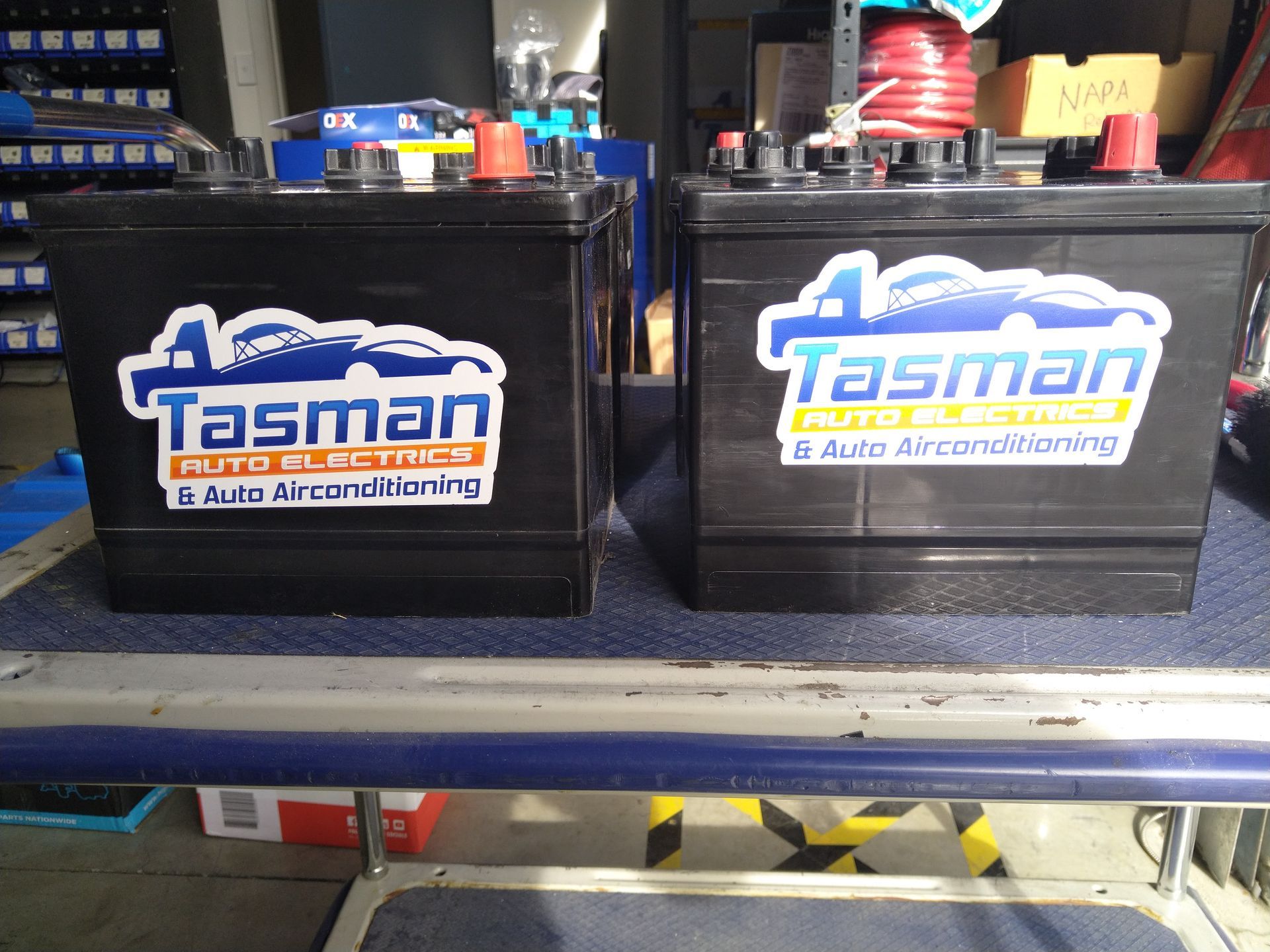 Two black car batteries with the 