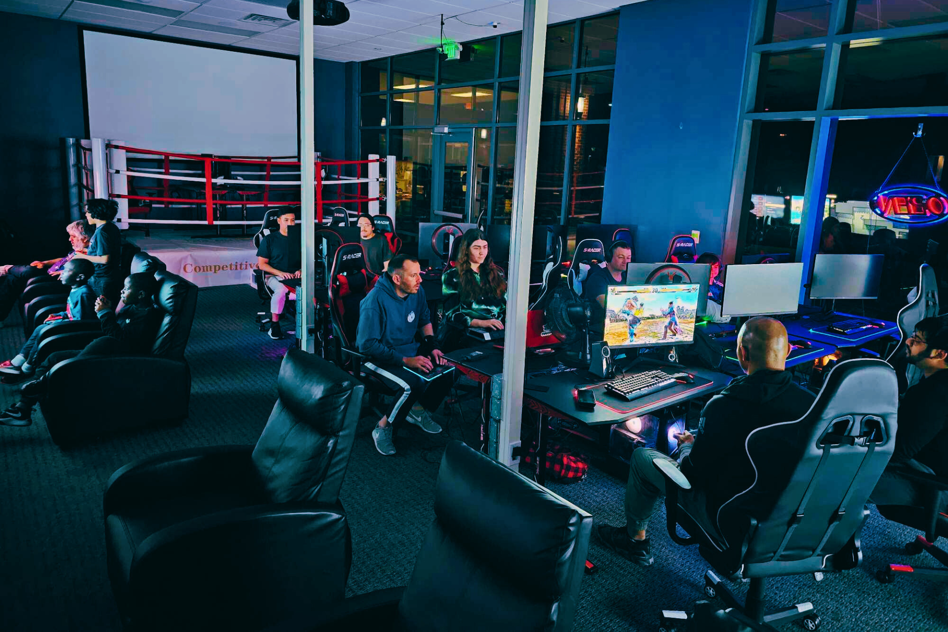 A group of people are playing video games in a room.